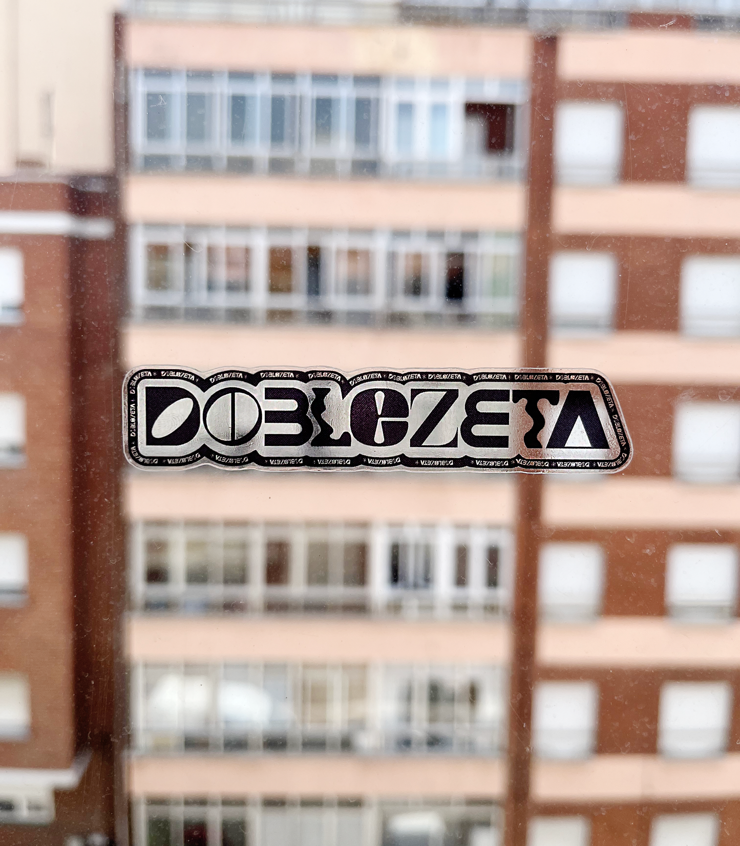 Pegatina DOBLEZETA Transparente Negro